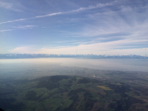 Picture window view out of a private jet over Friedrichshafen